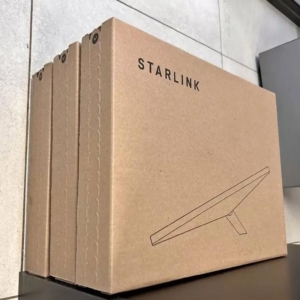 A Starlink satellite internet kit with dish, router, and cables for high-speed connectivity.